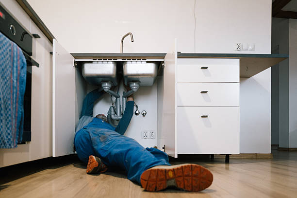 Professional Drain Cleaning technician working in Miramar Beach, FL